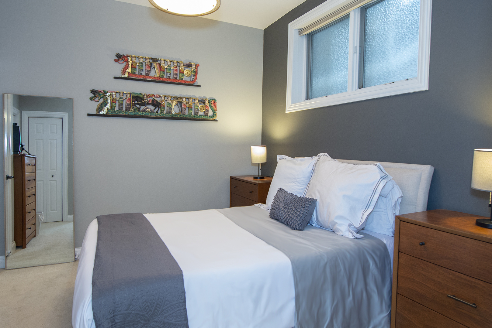 4606 North Malden Street, Unit GS Chicago, IL 60640 - Photo 8 of 16 a bedroom with a bed and a night stand