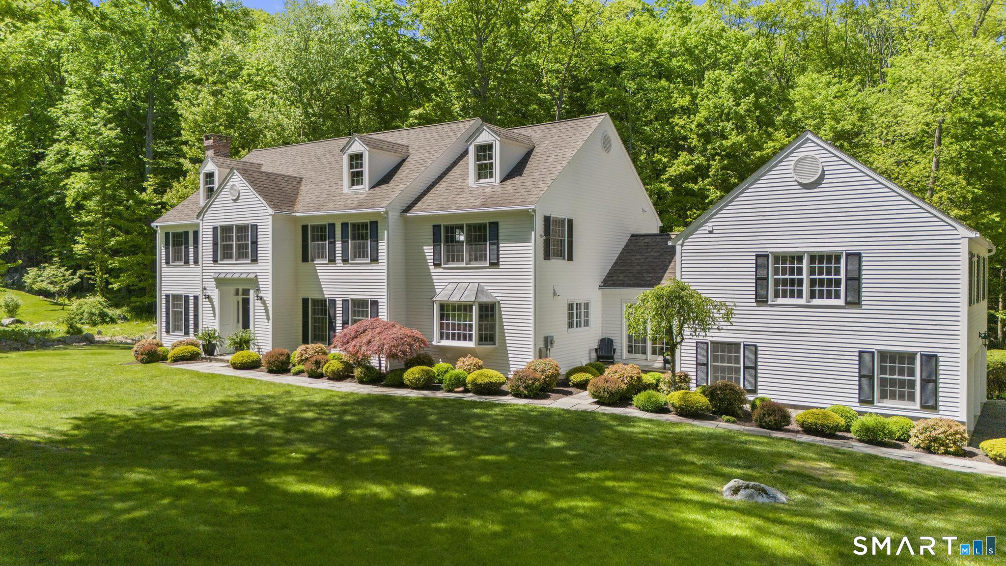 181 Old Branchville Road Ridgefield, CT 06877 - Photo 2 of 40 a front view of house with yard and green space