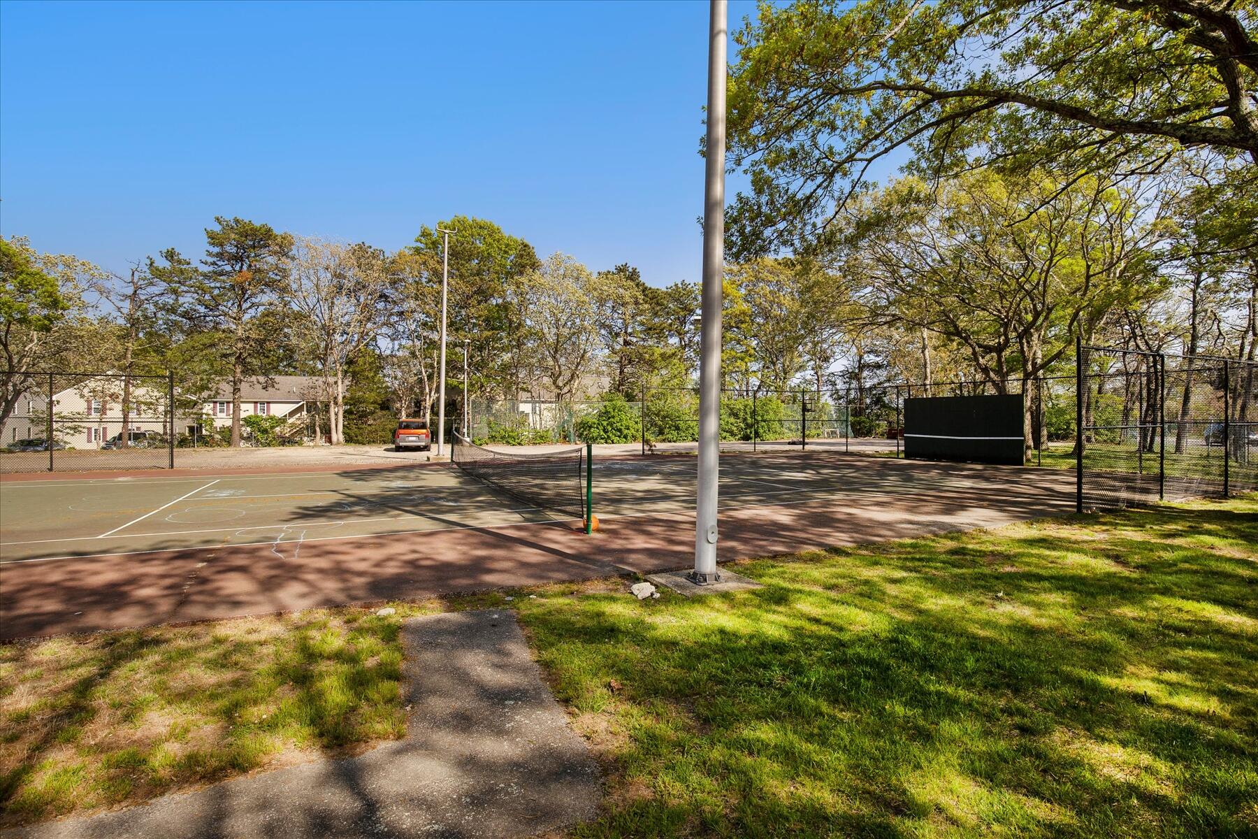 800 Bearses Way, Unit 1EB Hyannis, MA 02601 - Photo 24 of 37 a view of a yard with a tree