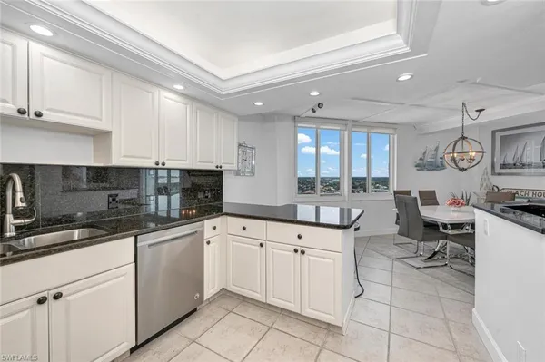 a dining room with furniture window and wooden floor