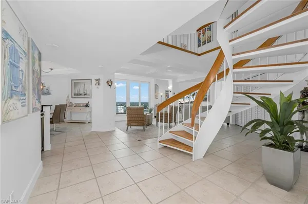 a view of a hallway with seating area