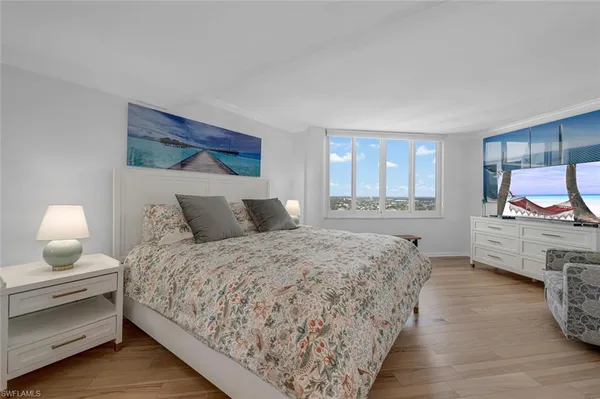a bathroom with a granite countertop double vanity sink a mirror and a shower