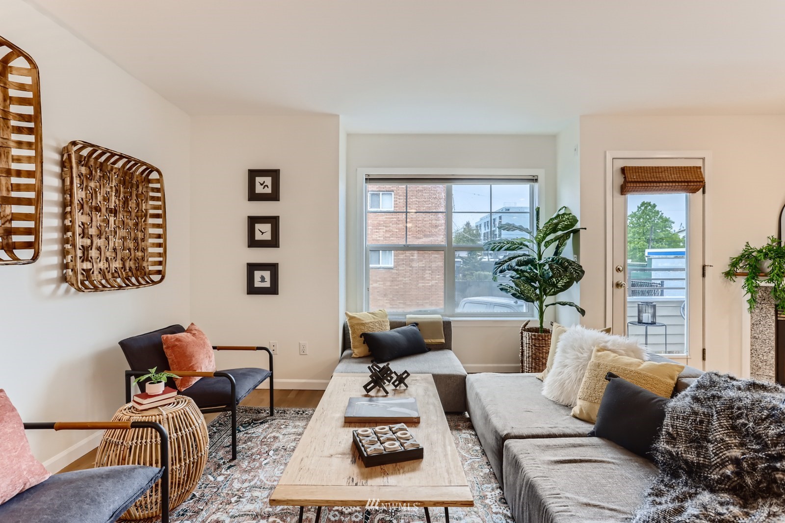 1512 Northwest 57th Street, Unit D Seattle, WA 98107 - Photo 1 of 29 a living room with furniture or couch and a potted plant