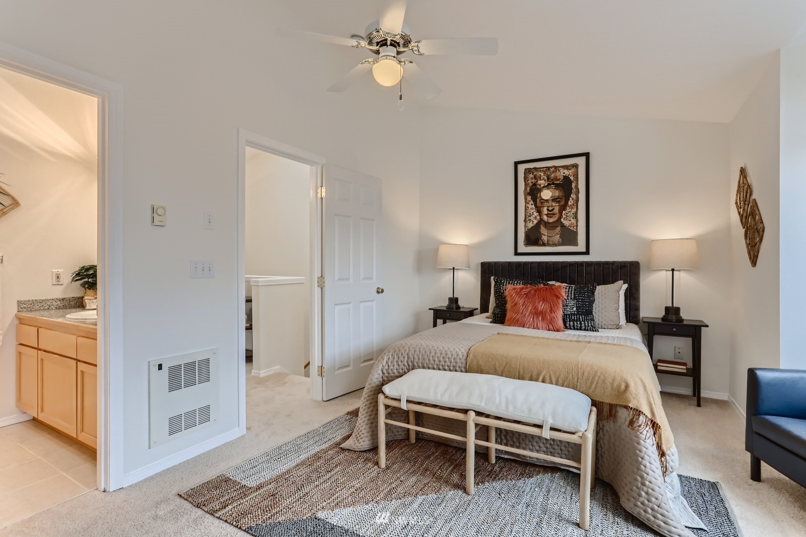 1512 Northwest 57th Street, Unit D Seattle, WA 98107 - Photo 13 of 29 a bedroom with a bed and a chandelier