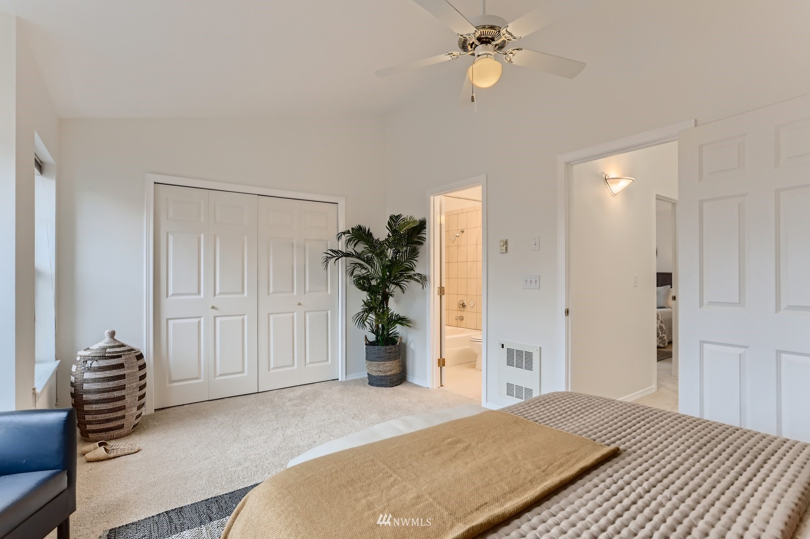 1512 Northwest 57th Street, Unit D Seattle, WA 98107 - Photo 14 of 29 a bedroom with a bed and a chandelier