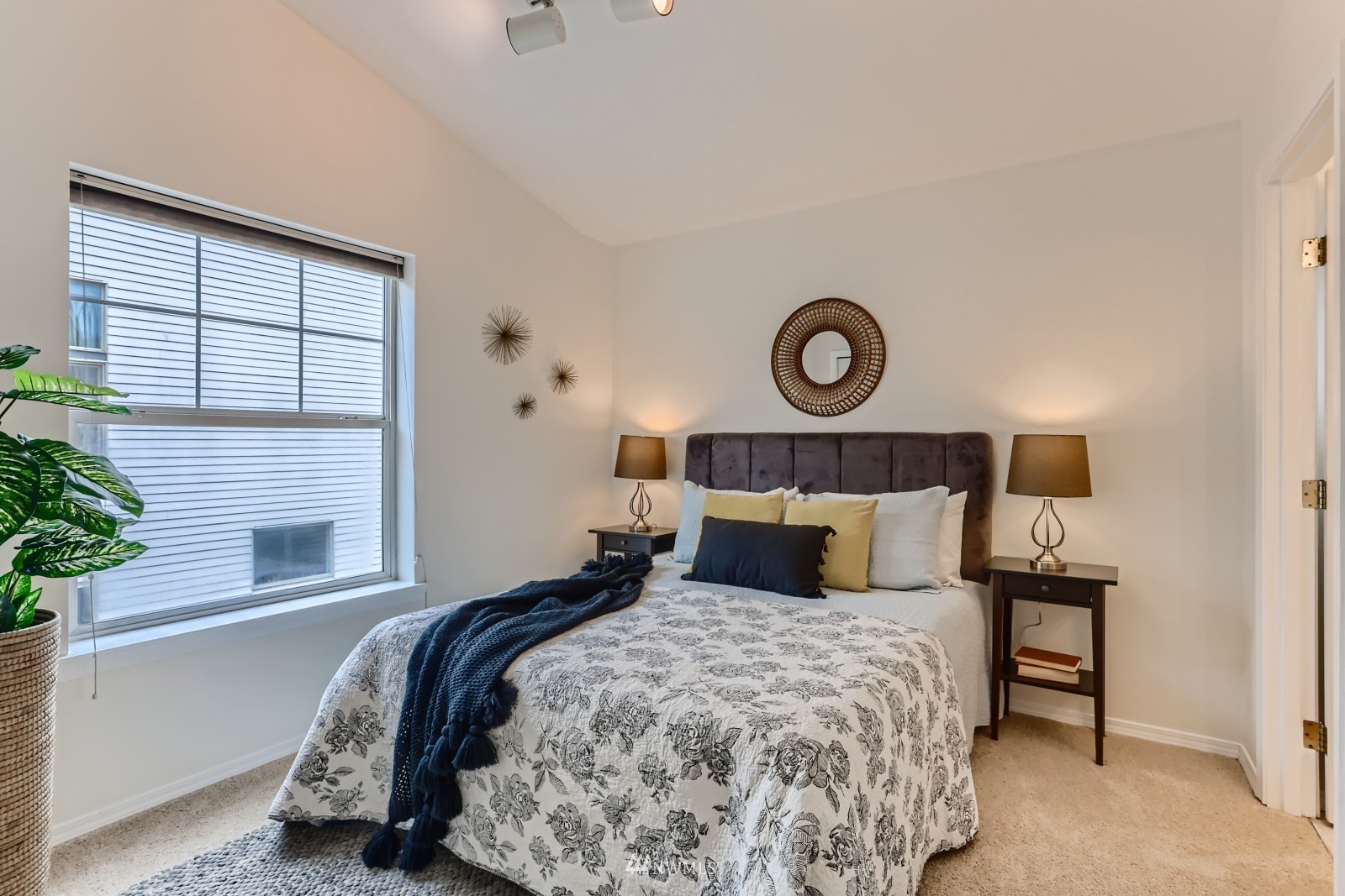 1512 Northwest 57th Street, Unit D Seattle, WA 98107 - Photo 16 of 29 a bedroom with a bed and a window