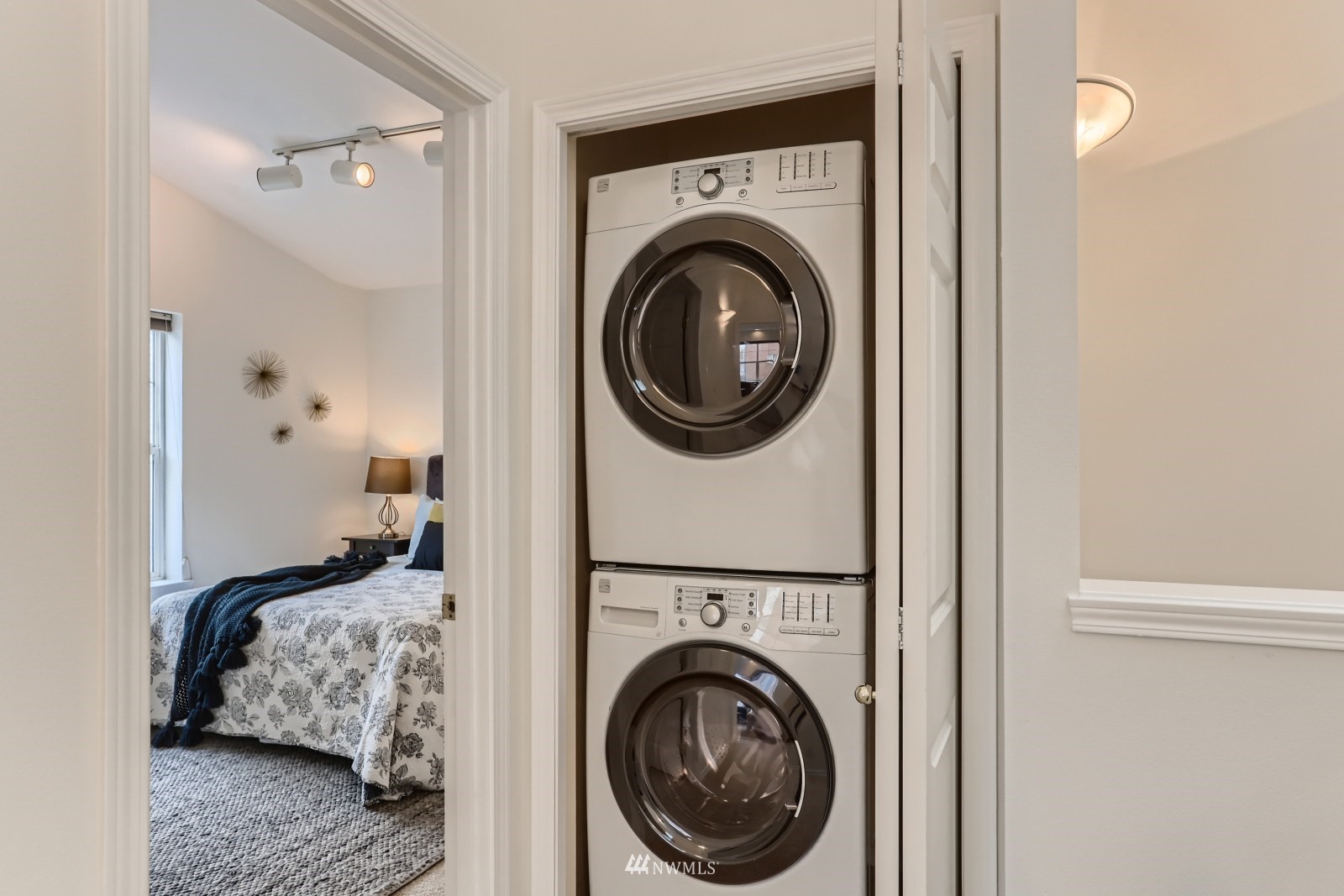 1512 Northwest 57th Street, Unit D Seattle, WA 98107 - Photo 20 of 29 a bedroom with a washing machine and a view of bedroom