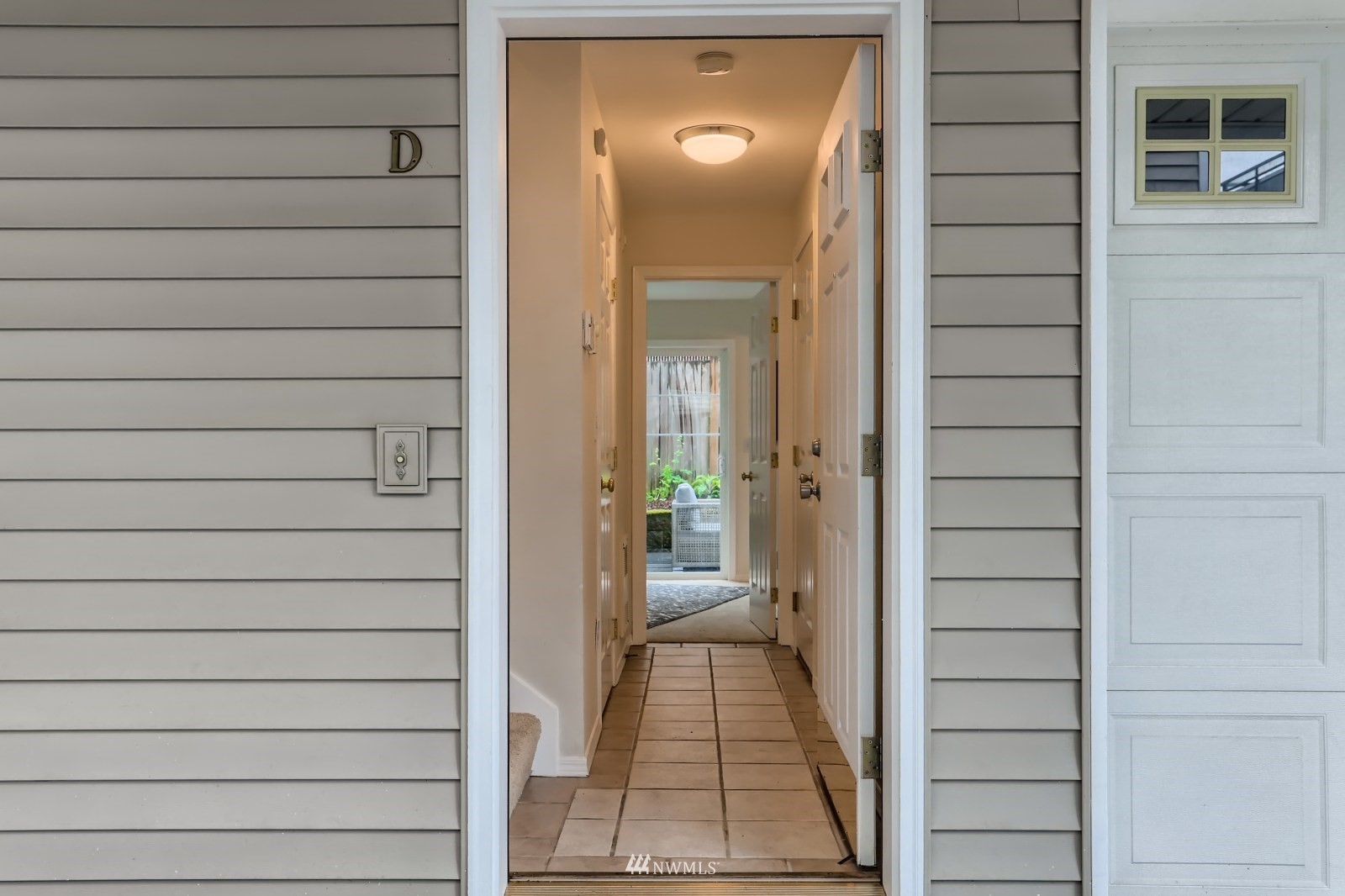 1512 Northwest 57th Street, Unit D Seattle, WA 98107 - Photo 28 of 29 a view of a door and a window