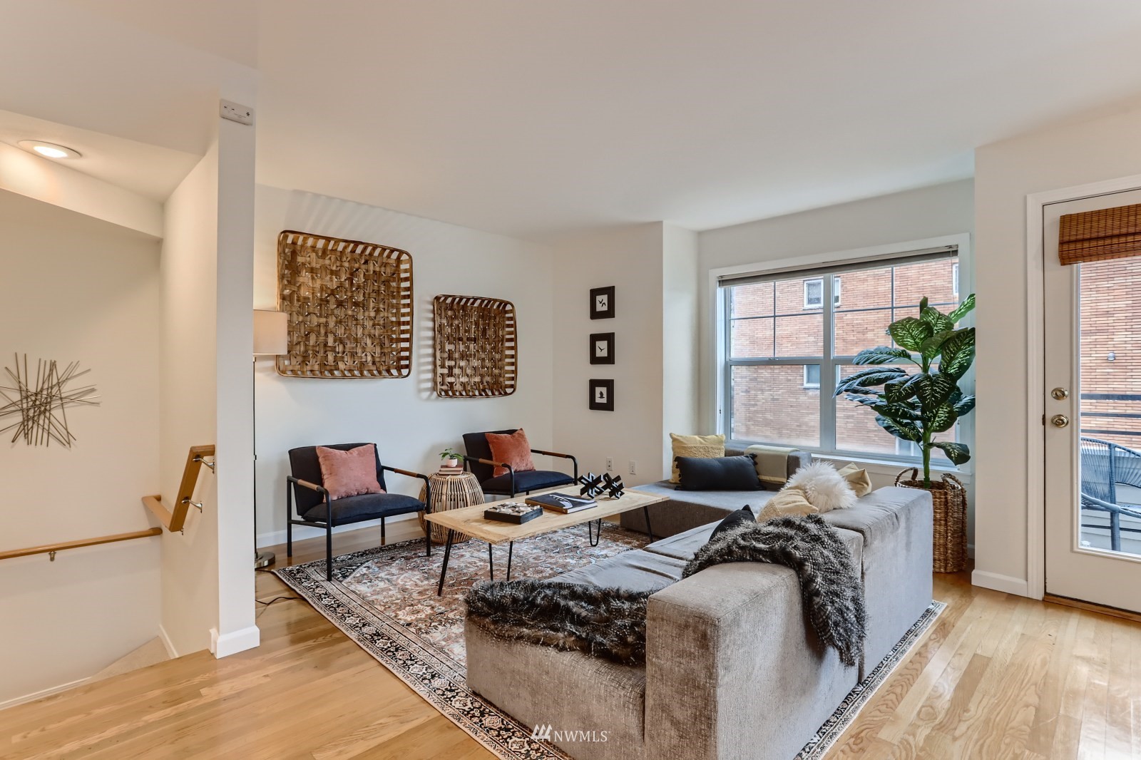 1512 Northwest 57th Street, Unit D Seattle, WA 98107 - Photo 3 of 29 a bed room with couch and a window