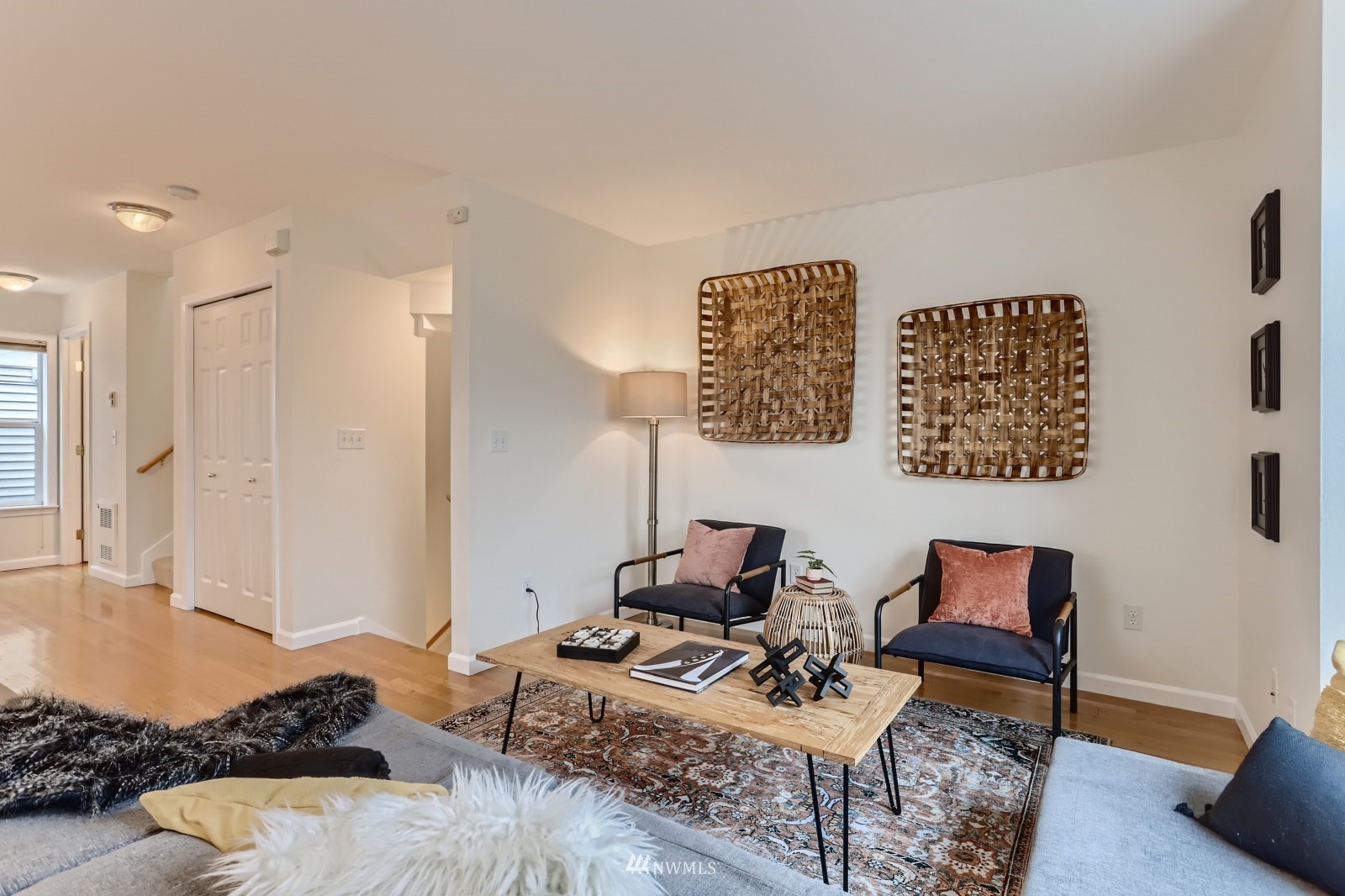 1512 Northwest 57th Street, Unit D Seattle, WA 98107 - Photo 4 of 29 a living room with furniture and a wooden floor