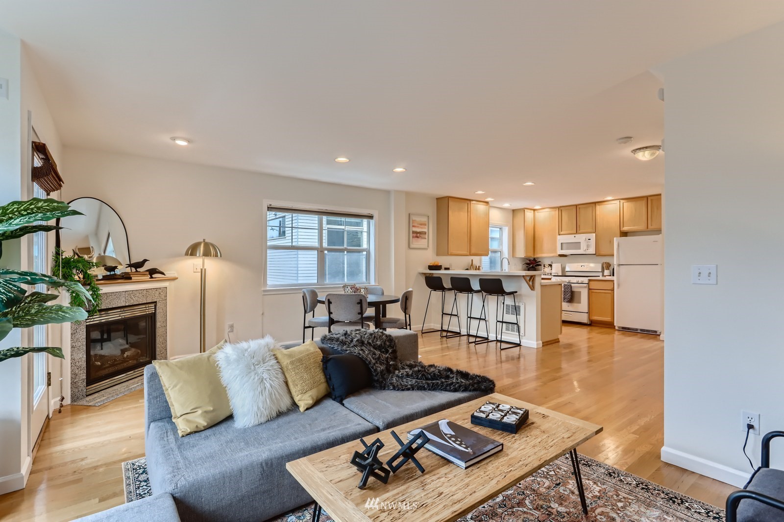 1512 Northwest 57th Street, Unit D Seattle, WA 98107 - Photo 5 of 29 a living room with furniture and a wooden floor