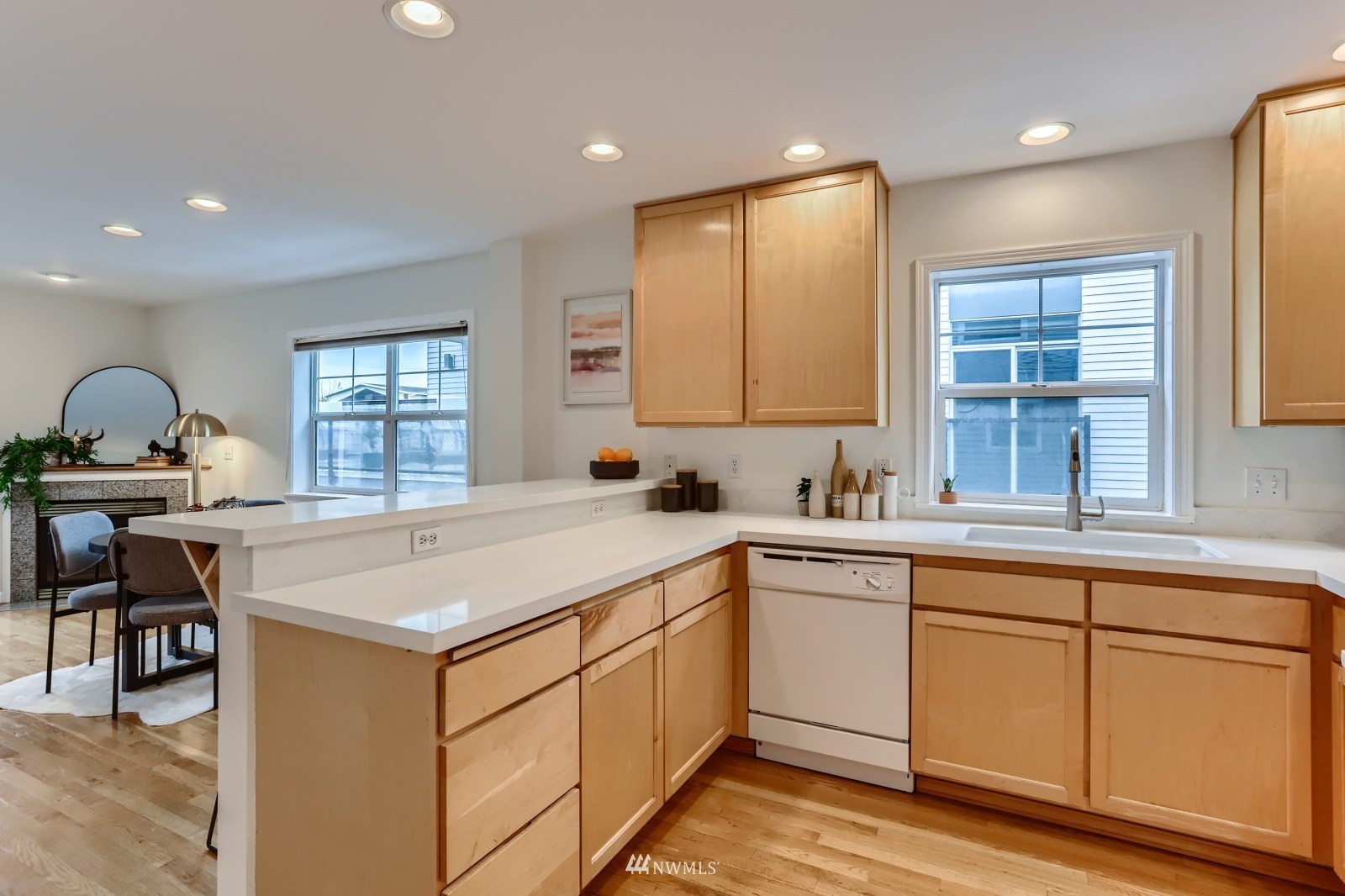 1512 Northwest 57th Street, Unit D Seattle, WA 98107 - Photo 10 of 29 a kitchen with a sink stove and cabinets