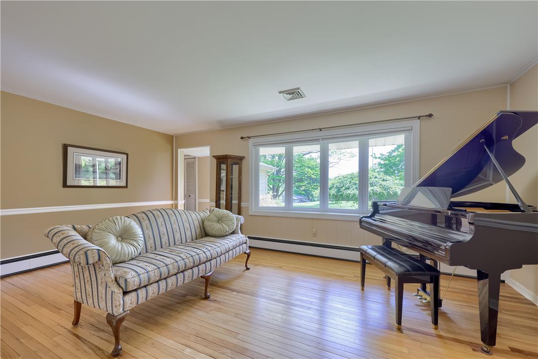 Coldsprings Rd Union Pottstown, PA 19465 - Photo 41 of 71 Sun-filled room boasts gleaming hardwood flooring, ideal for a grand piano or entertaining.