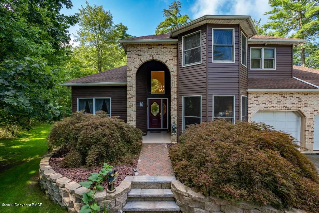 3023 Hemlock Road Stroudsburg, PA 18360 - Photo 42 of 46 a front view of a house with garden