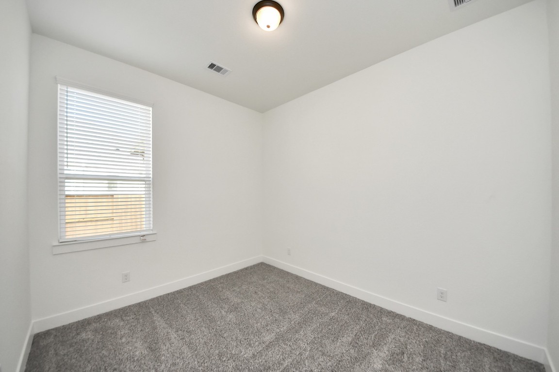 9519 Chateau Hill Manvel, TX 77578 - Photo 21 of 35 an empty room with a window