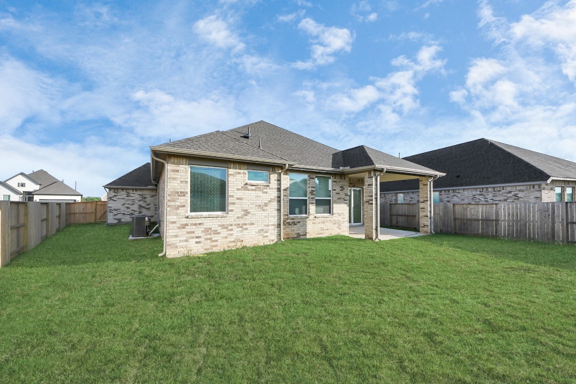 9519 Chateau Hill Manvel, TX 77578 - Photo 25 of 35 a front view of a house with a yard