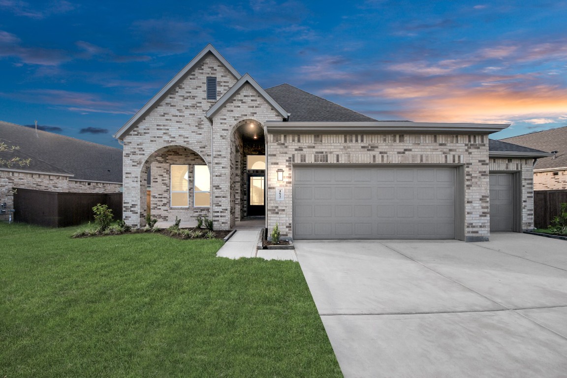 9519 Chateau Hill Manvel, TX 77578 - Photo 26 of 35 a front view of a house with a garden