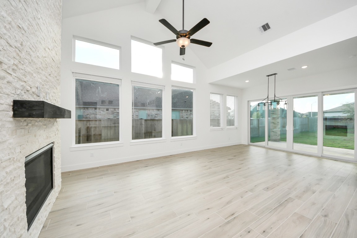 9519 Chateau Hill Manvel, TX 77578 - Photo 4 of 35 a view of an empty room with wooden floor and a window