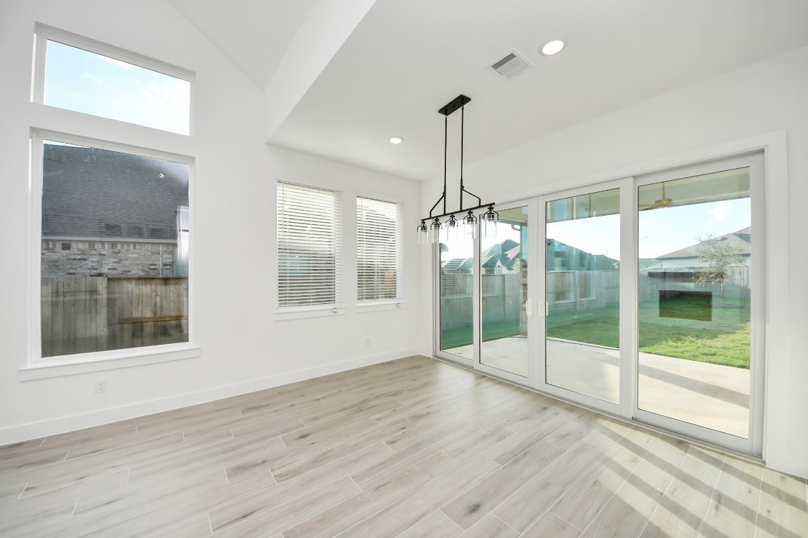 9519 Chateau Hill Manvel, TX 77578 - Photo 6 of 35 a view of empty room with wooden floor and windows