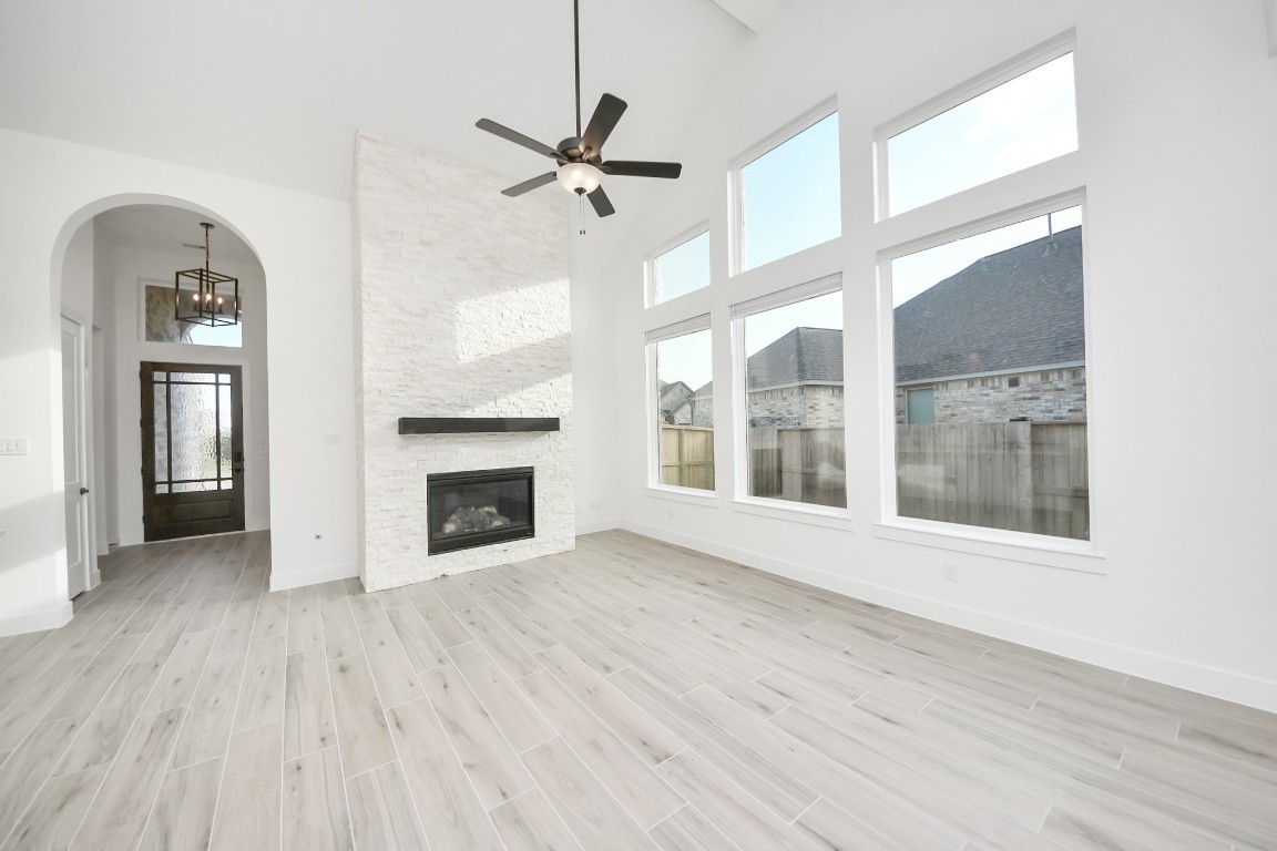 9519 Chateau Hill Manvel, TX 77578 - Photo 8 of 35 a view of an empty room with a window and fireplace