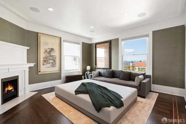 a bedroom with a bed and a painting