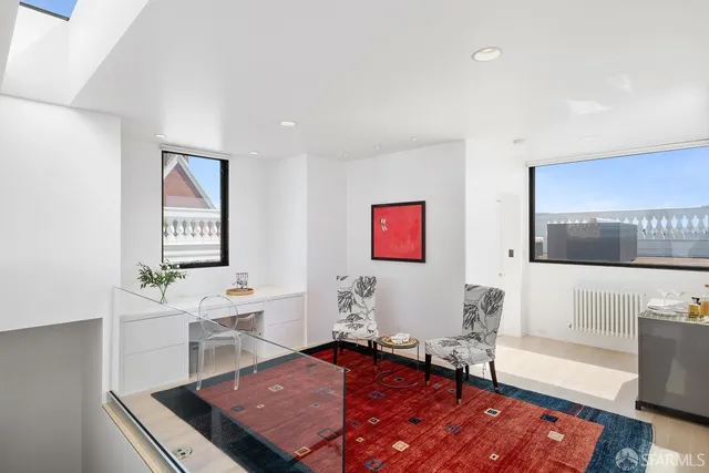 a view of a terrace with wooden floor and furniture