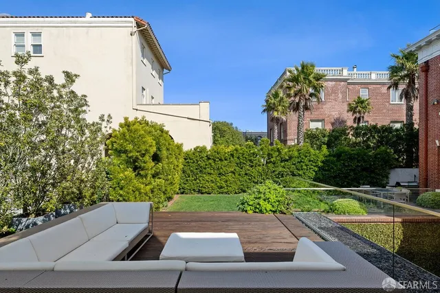 a view of a house with backyard porch and sitting area
