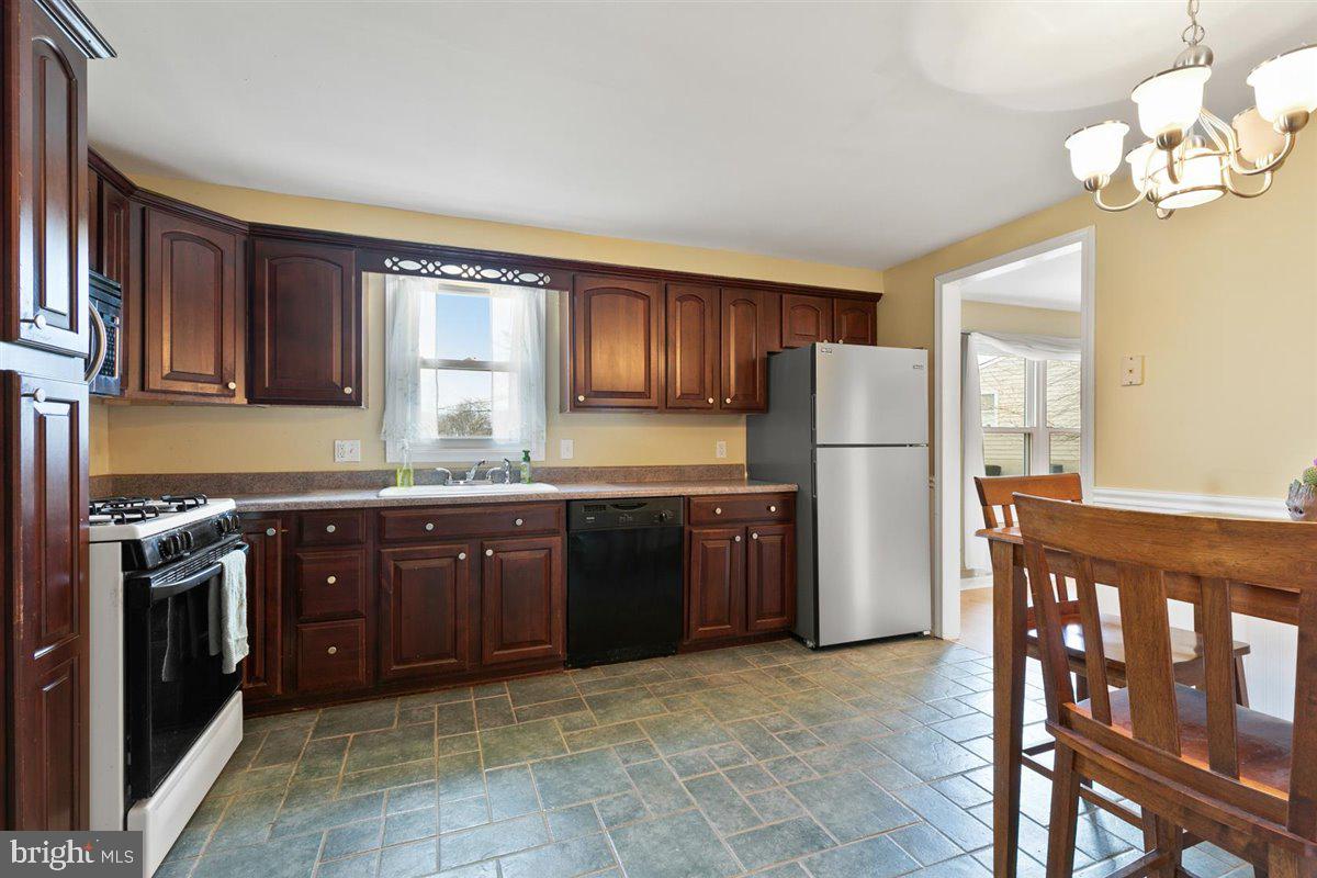 579 Crosswinds Drive Lititz, PA 17543 - Photo 33 of 64 Large kitchen with beautiful dark wood cabinets