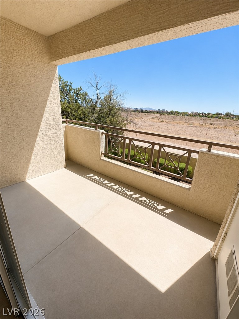 8070 West Russell Road, Unit 2023 Las Vegas, NV 89113 - Photo 3 of 6 Step out onto this elevated balcony and savor wide-ranging, arid landscape views under an open sky.