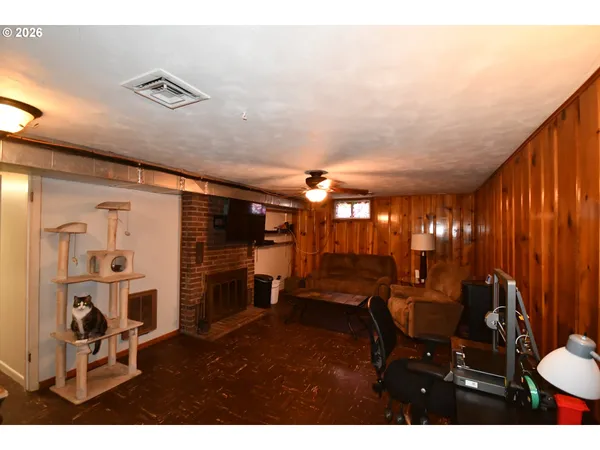 a view of a livingroom with furniture and a ceiling fan