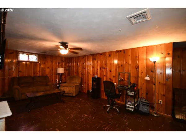 a view of living room with furniture and chandelier