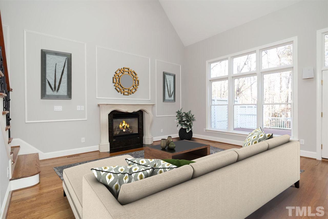 5220 Deergrass Court Raleigh, NC 27613 - Photo 11 of 25 a living room with furniture and a fireplace