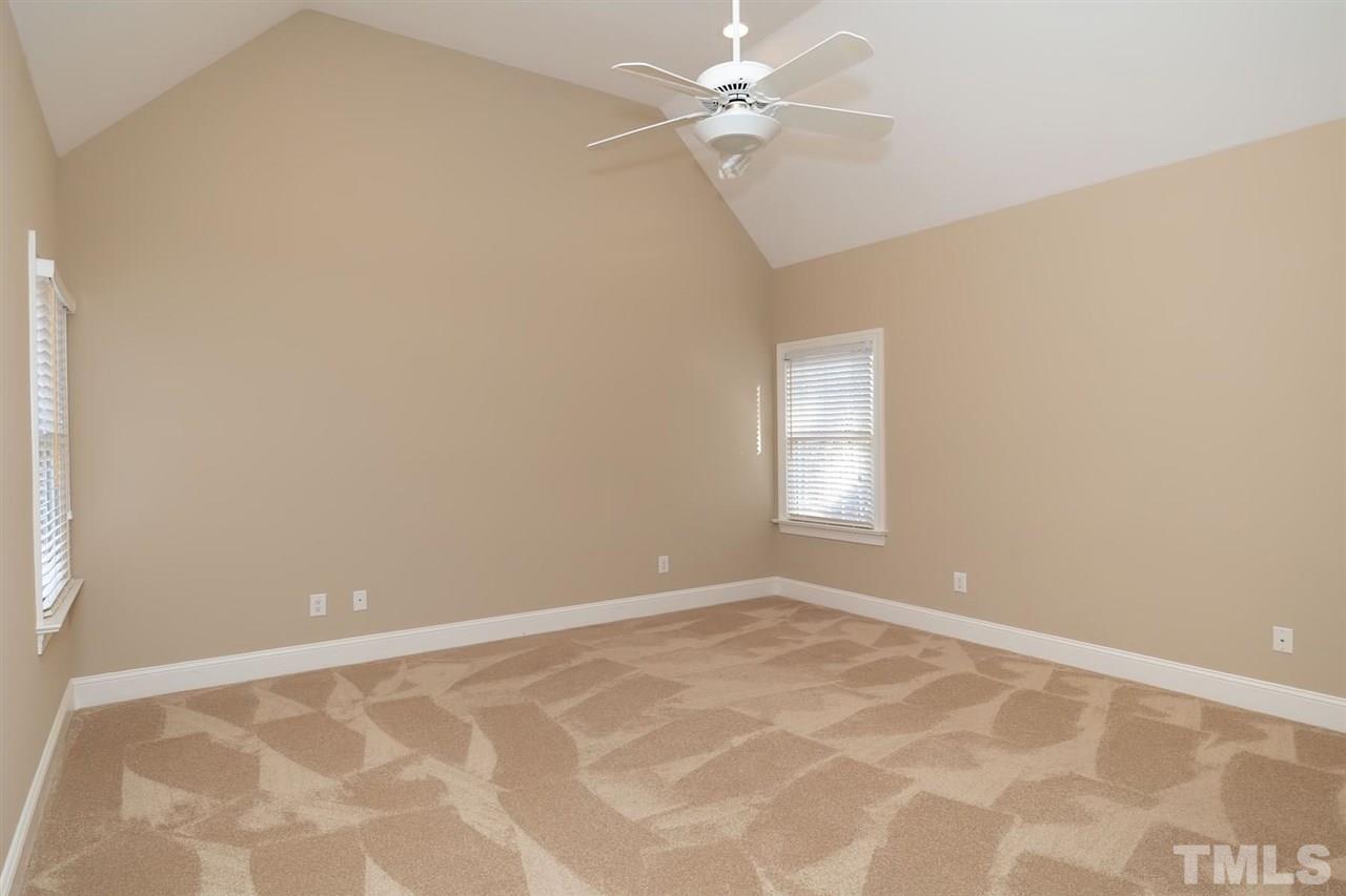 5220 Deergrass Court Raleigh, NC 27613 - Photo 21 of 25 a view of an empty room with a window