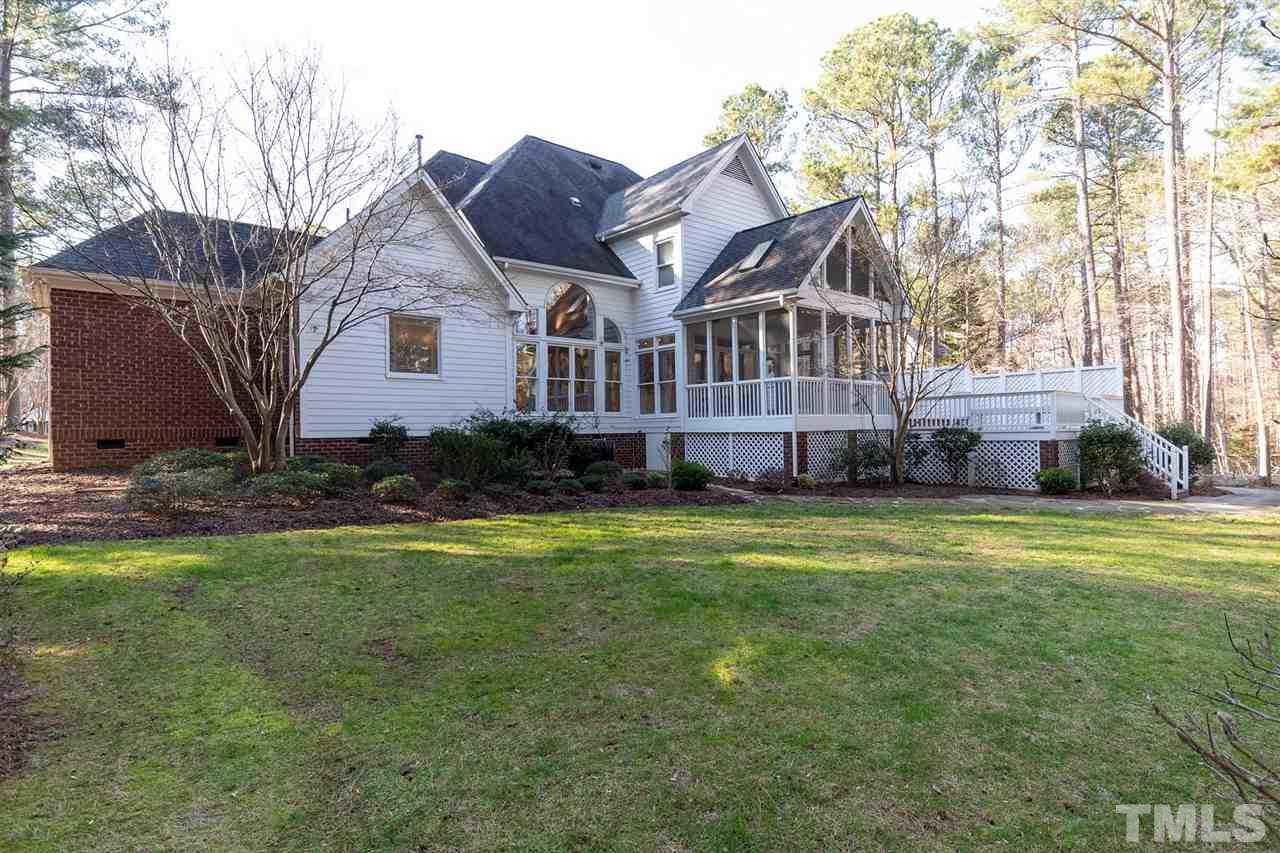 5220 Deergrass Court Raleigh, NC 27613 - Photo 24 of 25 a front view of a house with a garden