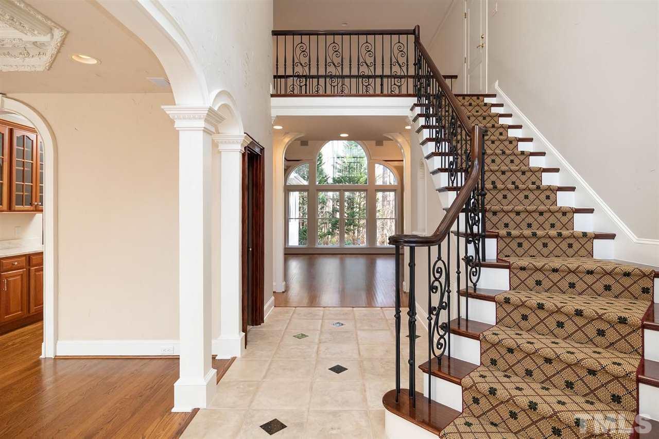5220 Deergrass Court Raleigh, NC 27613 - Photo 5 of 25 a view of an entryway with wooden floor