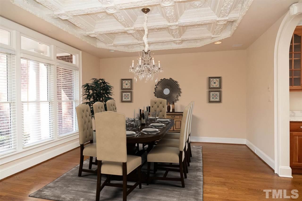 5220 Deergrass Court Raleigh, NC 27613 - Photo 6 of 25 a dining room with chandelier and wooden floor