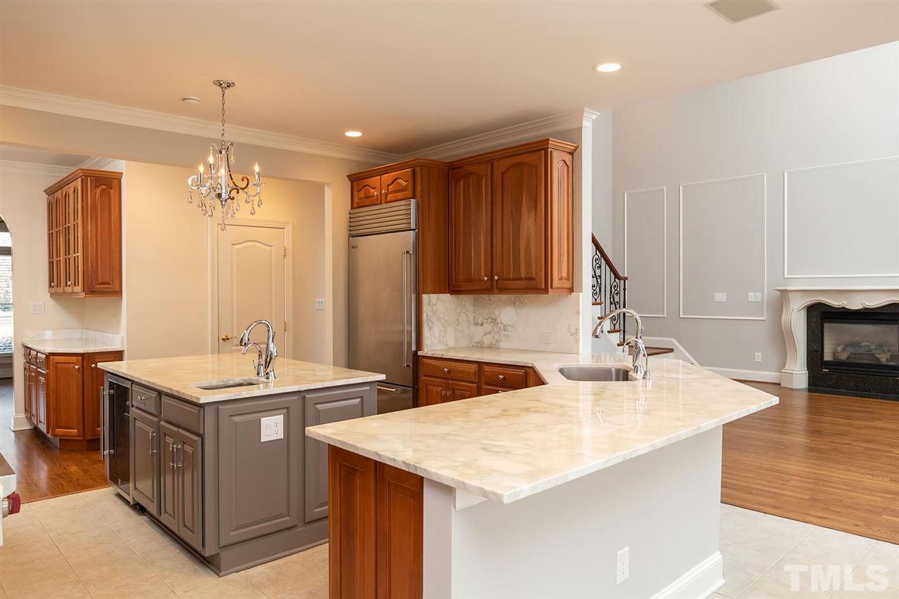 5220 Deergrass Court Raleigh, NC 27613 - Photo 8 of 25 a bathroom with a sink double vanity and a mirror