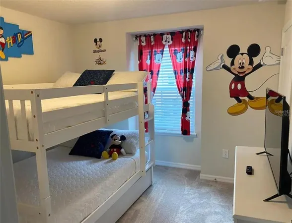 a bedroom with a bed and cabinets