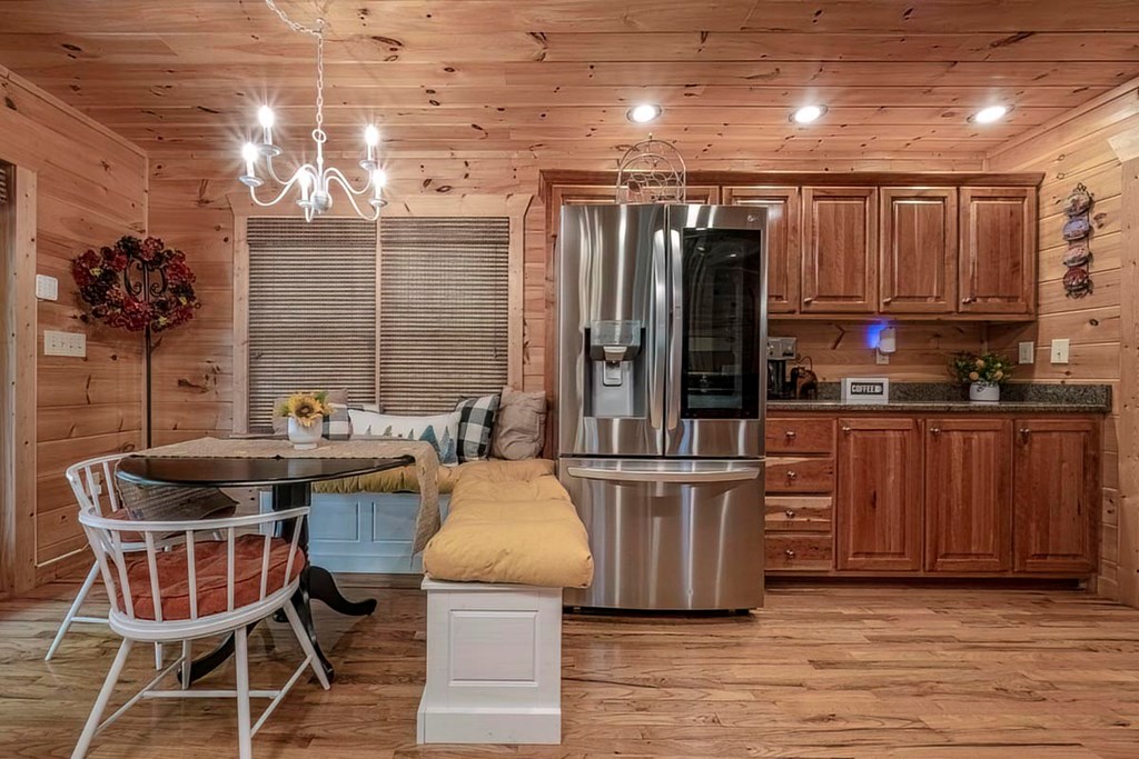 781 Mangum's Trail Blue Ridge, GA 30513 - Photo 15 of 65 a kitchen with kitchen island granite countertop wooden cabinets and stainless steel appliances