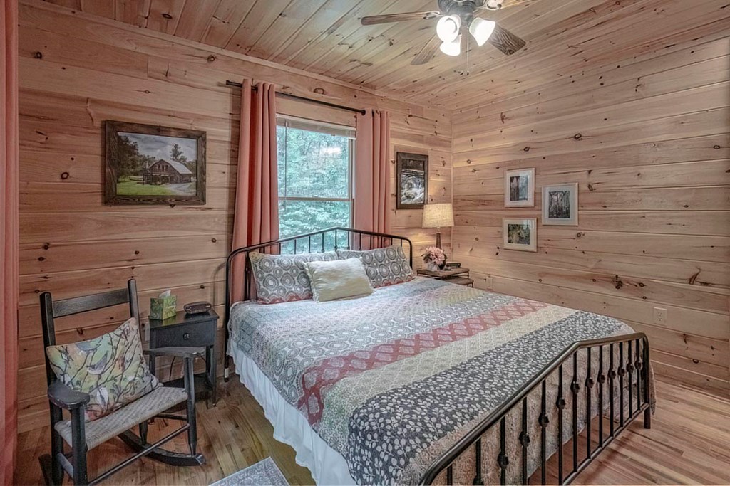 781 Mangum's Trail Blue Ridge, GA 30513 - Photo 17 of 65 a bedroom with a bed and a table in it