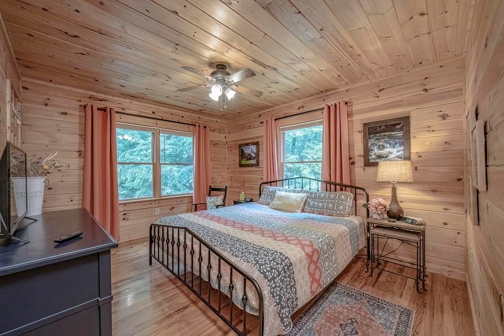 781 Mangum's Trail Blue Ridge, GA 30513 - Photo 18 of 65 a bedroom with a bed next to a window with the outer view