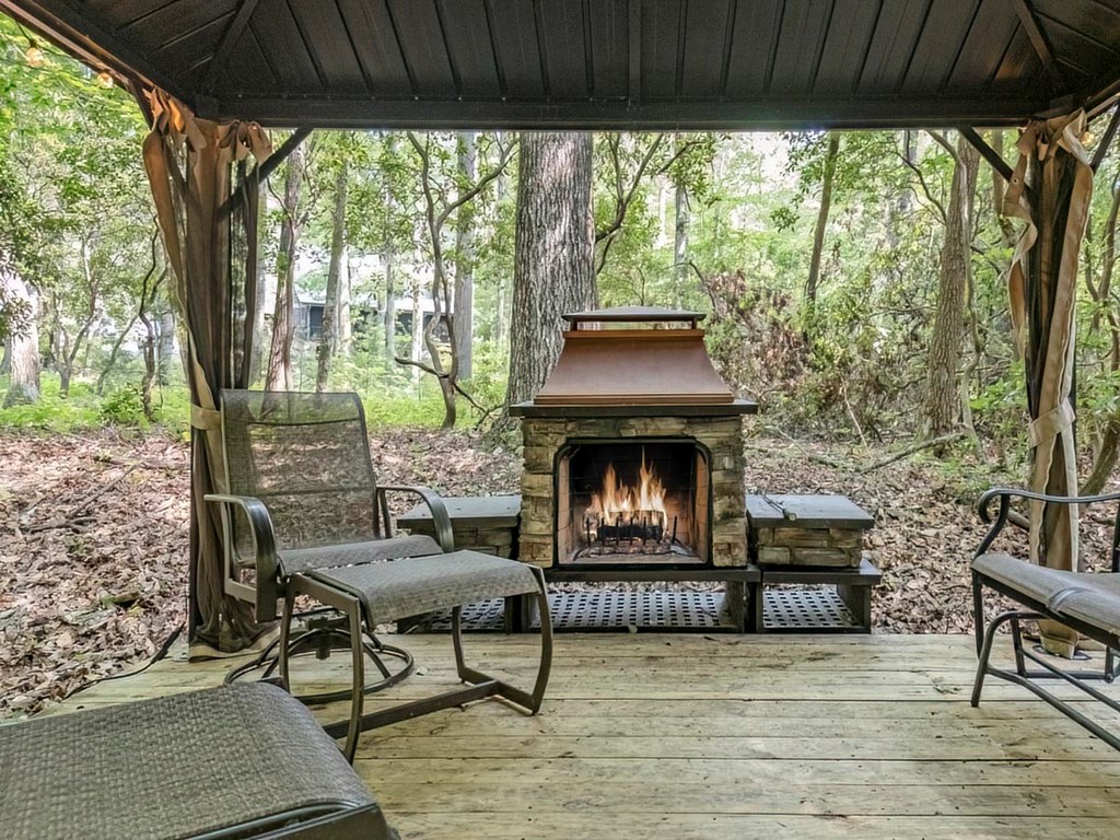 781 Mangum's Trail Blue Ridge, GA 30513 - Photo 28 of 65 a living room with furniture and a fireplace