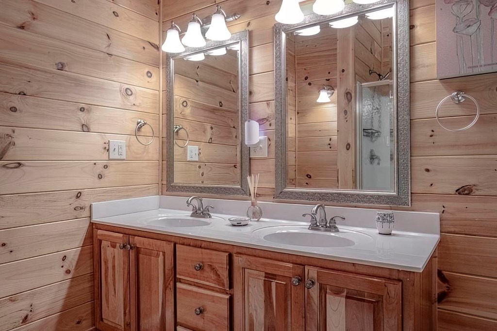 781 Mangum's Trail Blue Ridge, GA 30513 - Photo 38 of 65 a bathroom with a sink double vanity and a mirror