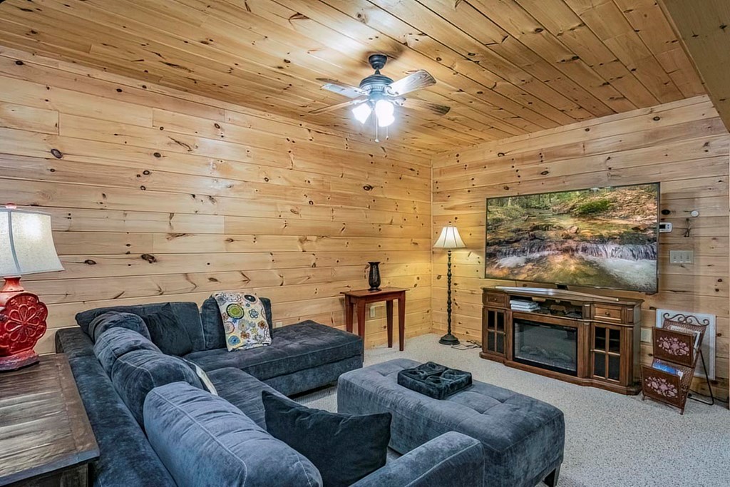 781 Mangum's Trail Blue Ridge, GA 30513 - Photo 50 of 65 a living room with furniture and a fireplace