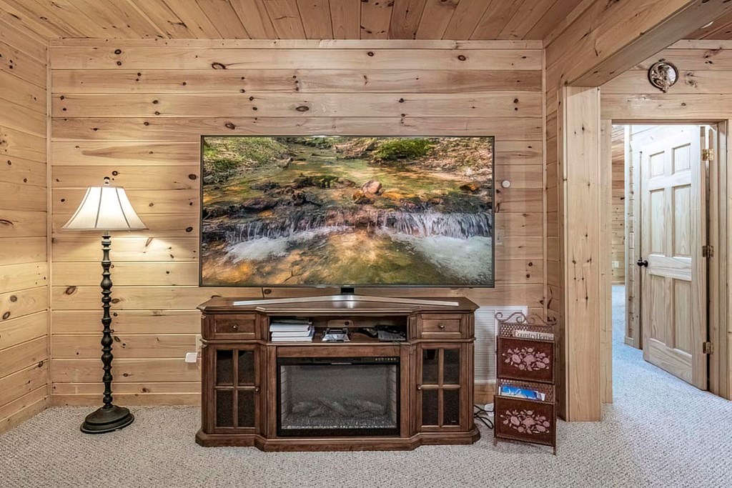 781 Mangum's Trail Blue Ridge, GA 30513 - Photo 51 of 65 a view of an empty room with a fireplace