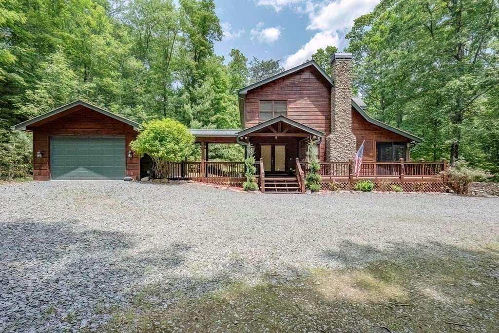 781 Mangum's Trail Blue Ridge, GA 30513 - Photo 59 of 65 a view of a house with a yard and large tree