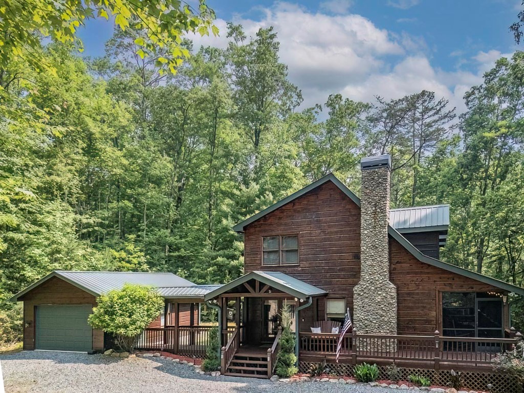 781 Mangum's Trail Blue Ridge, GA 30513 - Photo 60 of 65 a view of a house with a yard