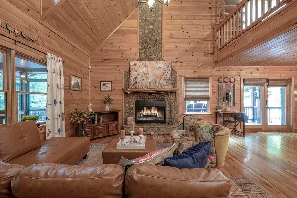 781 Mangum's Trail Blue Ridge, GA 30513 - Photo 9 of 65 a living room with furniture and a fireplace