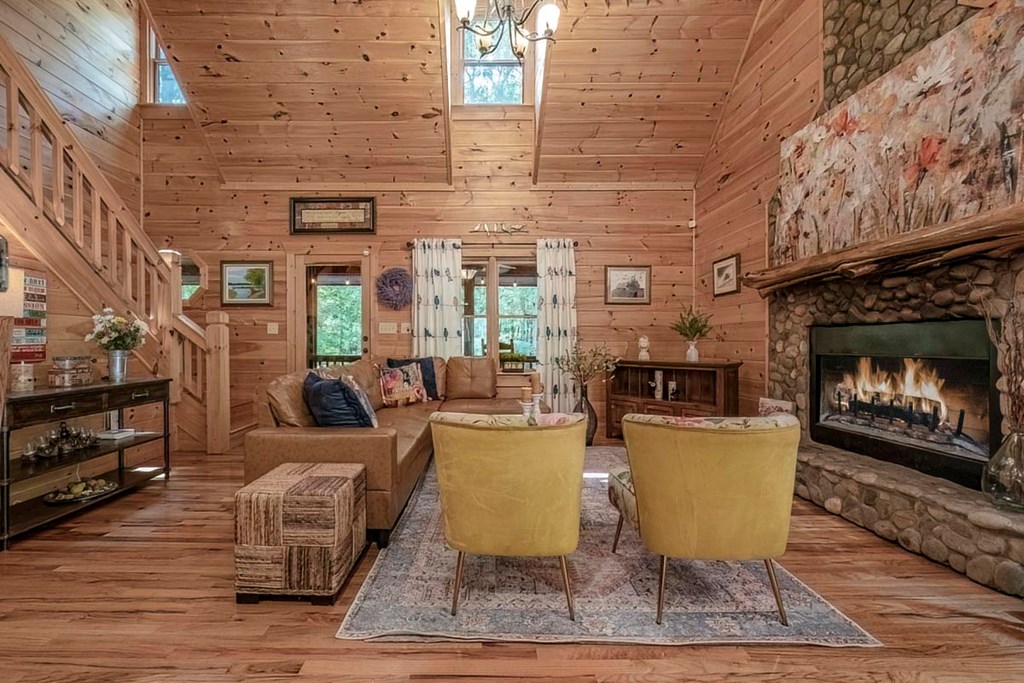 781 Mangum's Trail Blue Ridge, GA 30513 - Photo 10 of 65 a living room with furniture and a fireplace