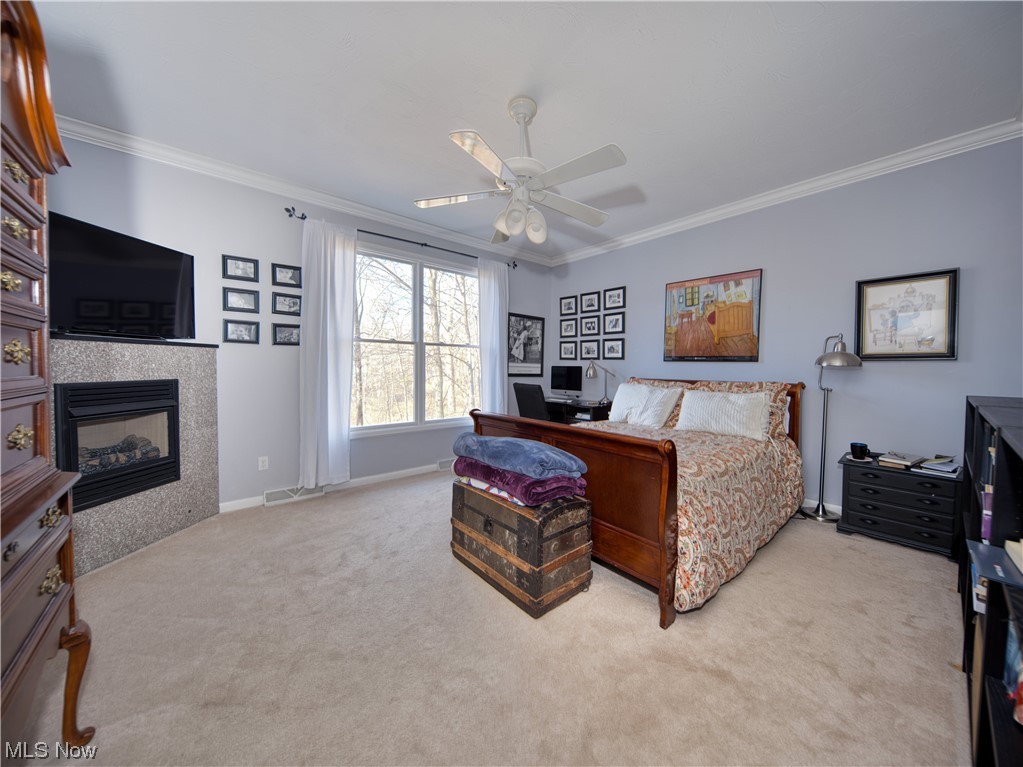 13730 Sperry Road Novelty, OH 44072 - Photo 13 of 31 Carpeted bedroom with ceiling fan and ornamental molding